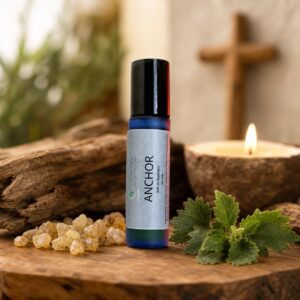 Anchor roll-on oil with lit candle